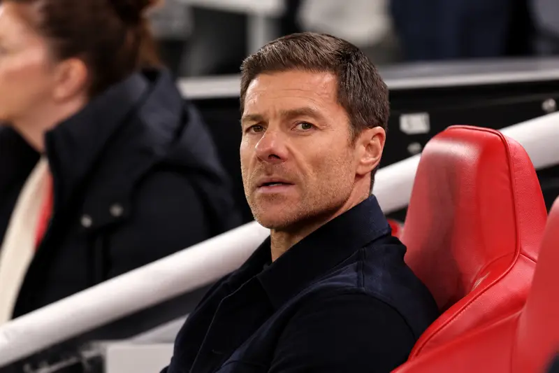 focused coach in red dugout